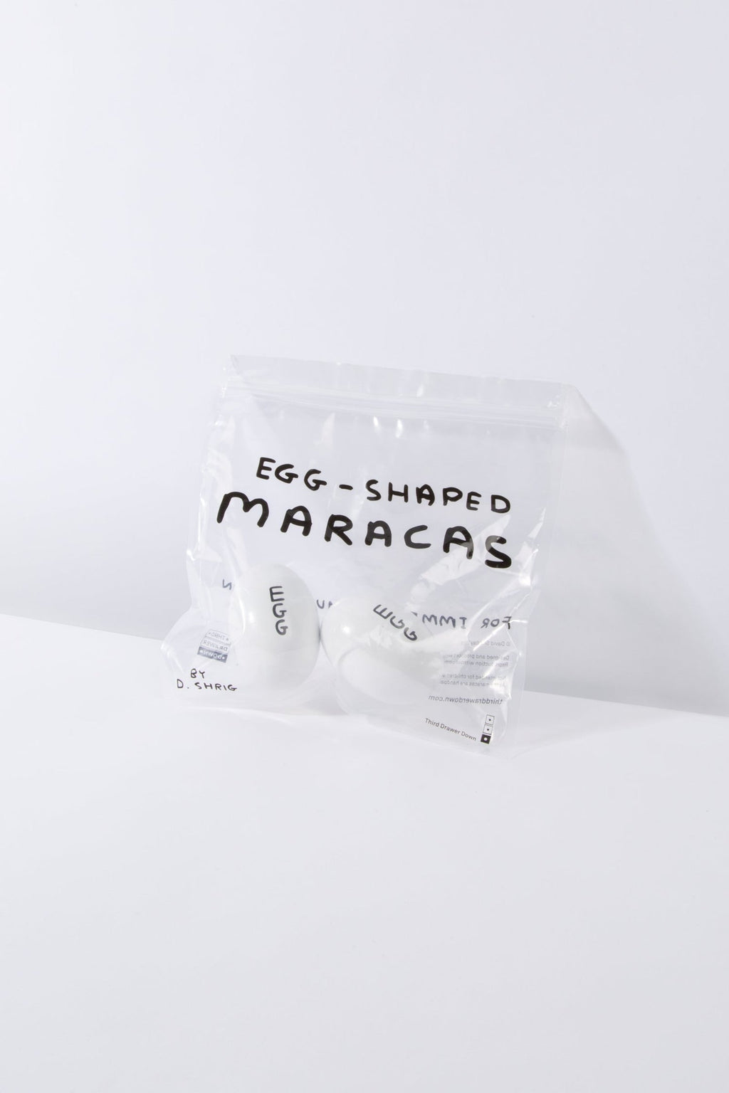 Egg-shaped Maracas by david shrigley x Third Drawer Down