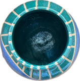 Lot 38: Beige, blue, and green ceramic vessel