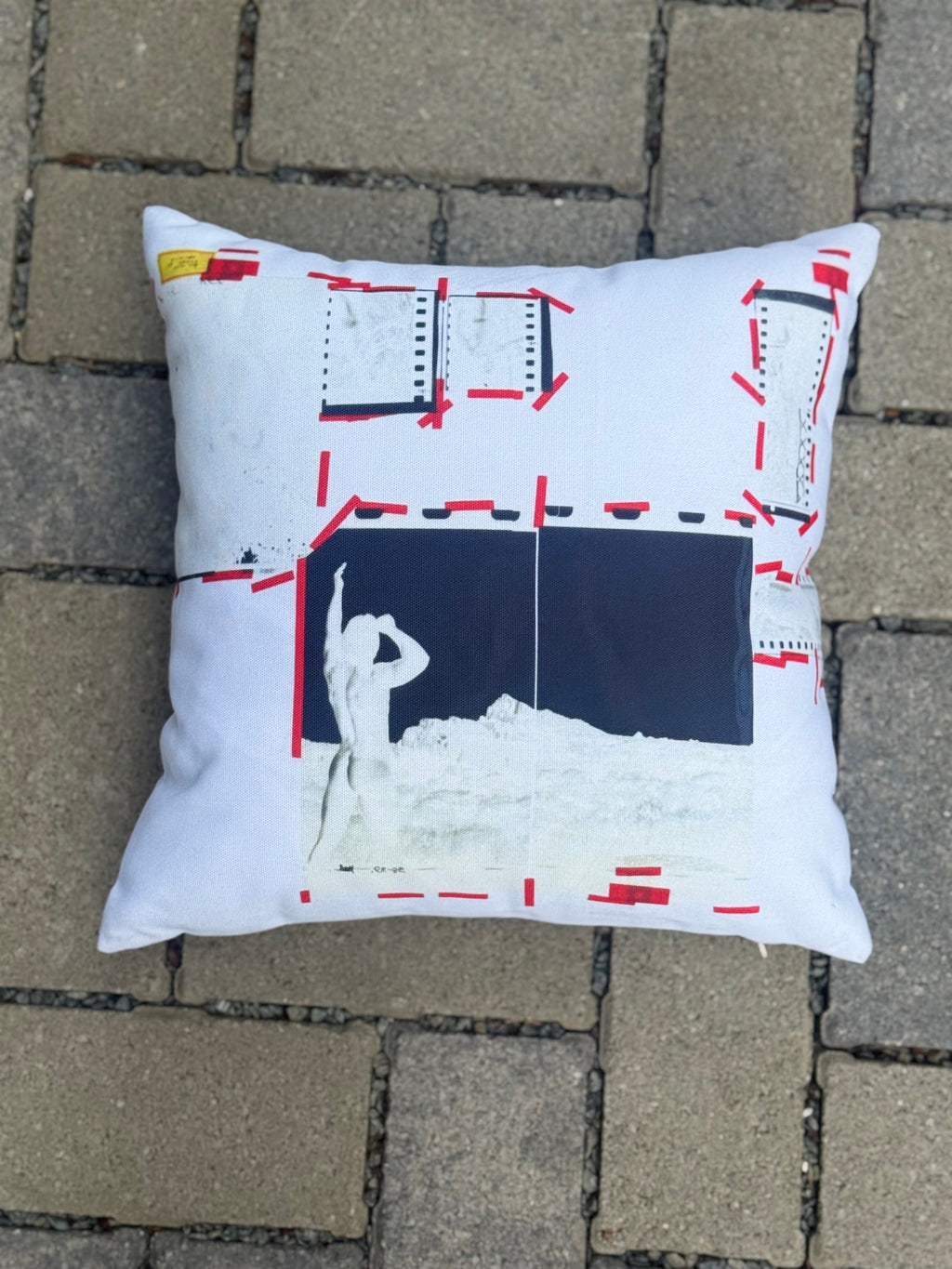 Cushion printed with vintage layout transparency artwork, first face