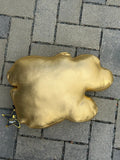 Reverse of the pillow in plain gold, with hang tag