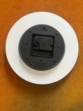 Reverse of the wall clock showing the quartz movement housing and hanging tab