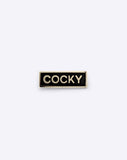 Cocky enamel pin by Dicks Don't Lie in Black