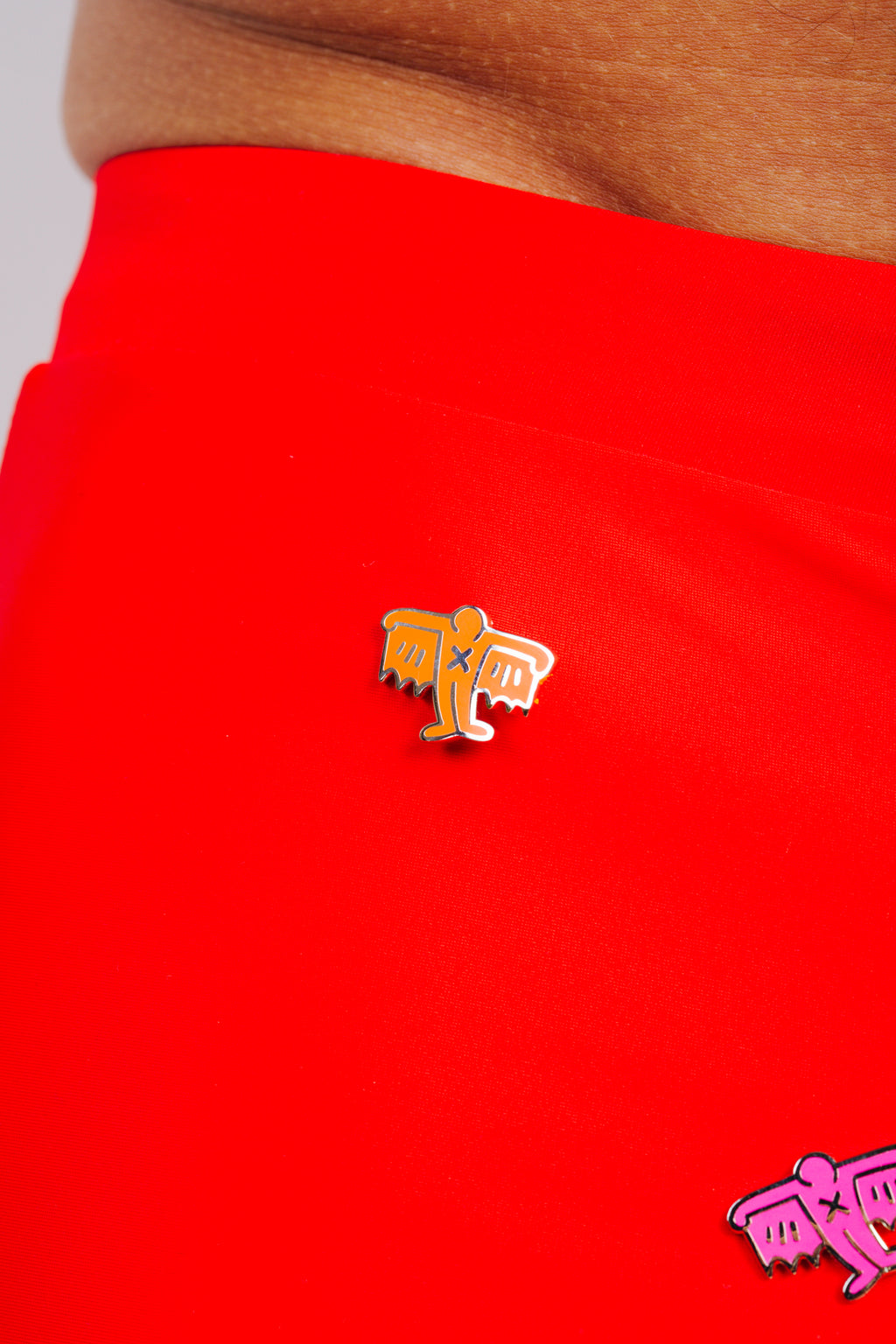 KEITH HARING BAT DEMON PIN - ORANGE