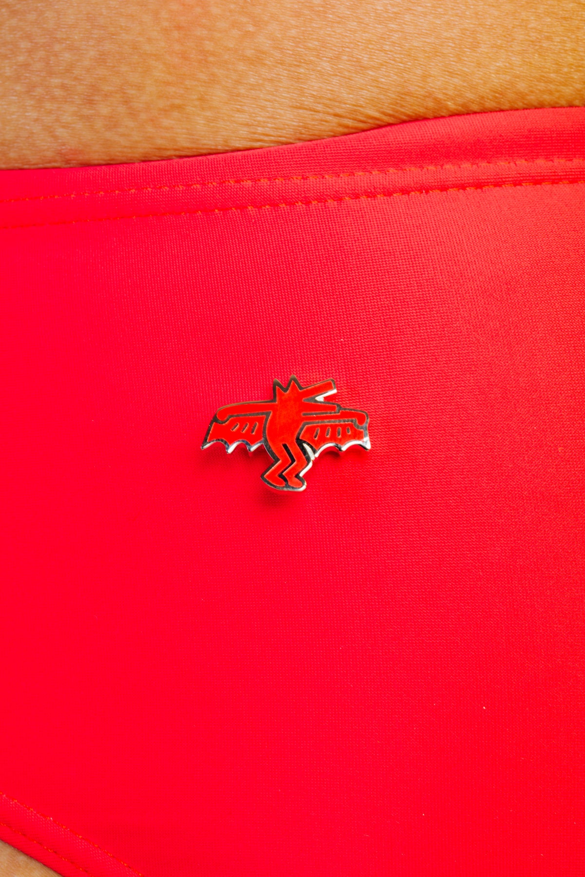 KEITH HARING BAT DOG PIN - RED